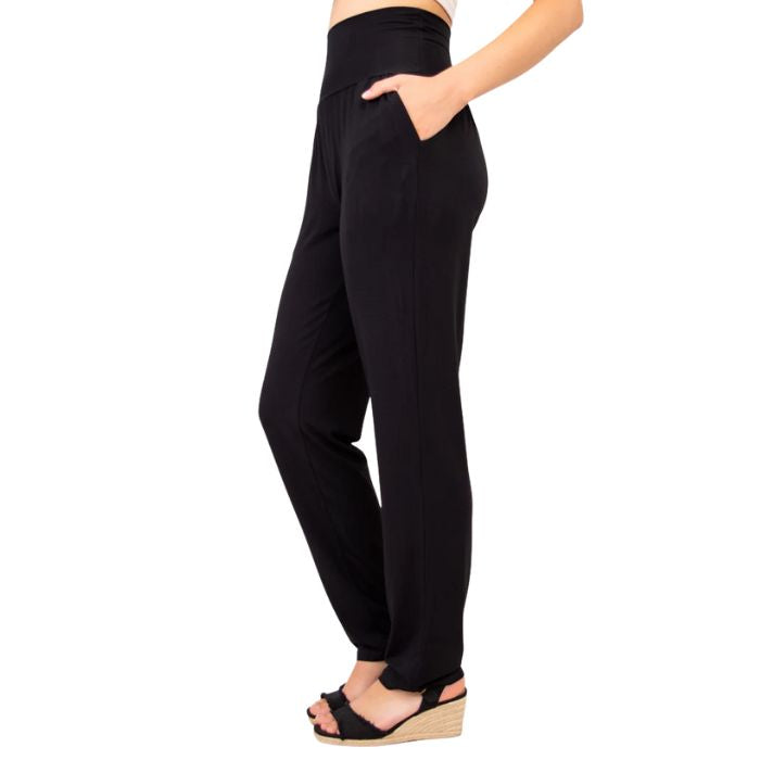 bottm of female model wearing black clair pants side front view on white backround