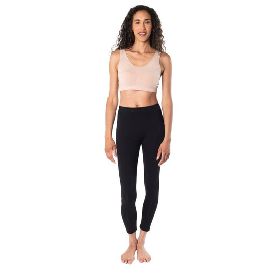 female mode wearing beige brown essential bralette and black suri leggings front view on white background