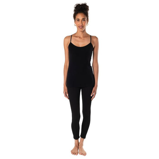 top of female model wearing black essential cami tank top and black suri leggings front view on white background