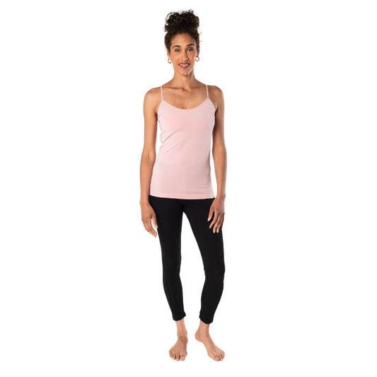 female model wearing pink essential cami tank top and black suri leggings front view on white background