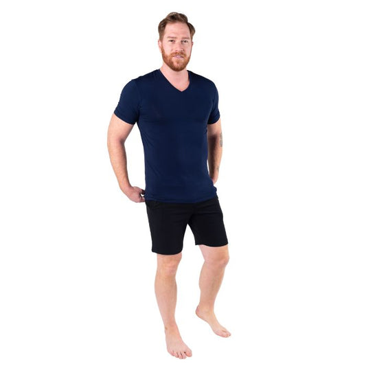 top of male model wearing ink blue huron v-neck t-shirt and black aspen shorts front view on white background