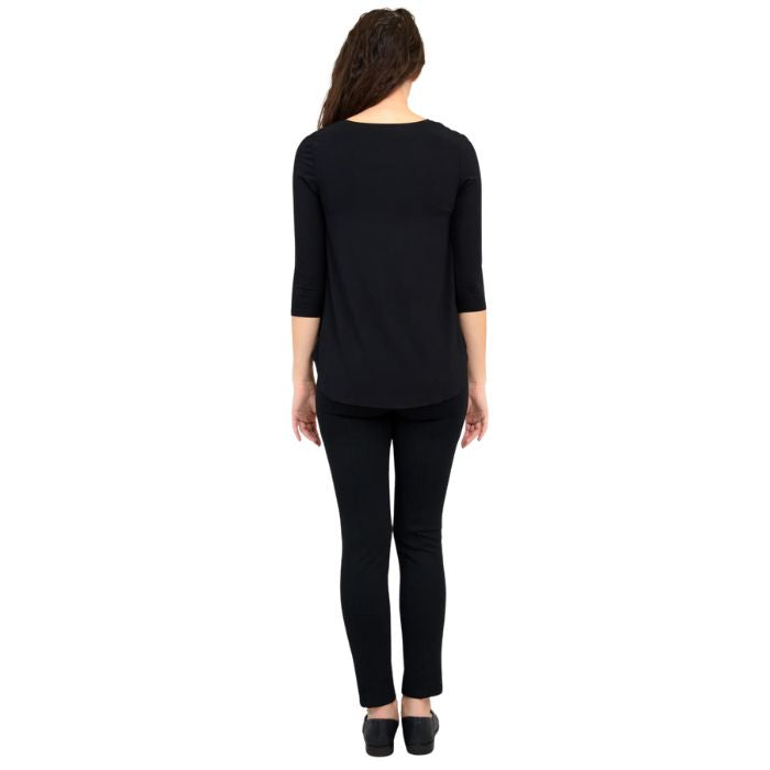 female model wearing jazz black three quarter sleeve top and nadia black pants back view on white background