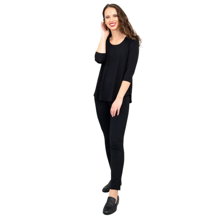 female model wearing jazz black three quarter sleeve top and nadia black pants side view on white background