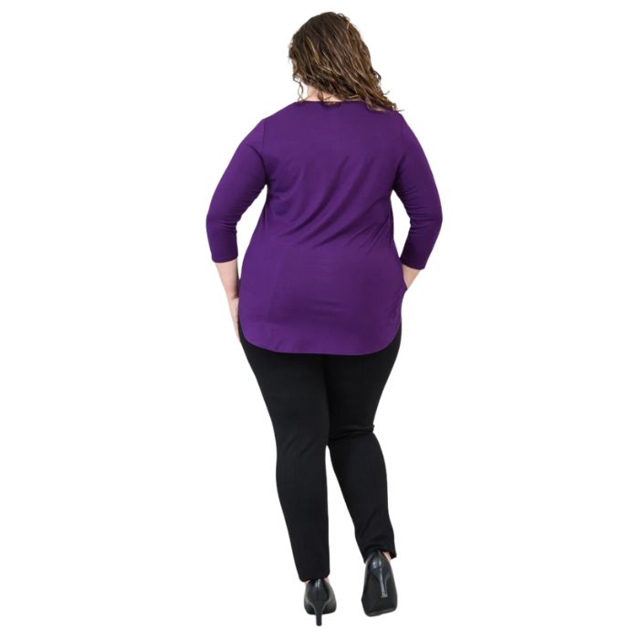 female model wearing jazz royal purple three quarter sleeve top and nadia black pants side view on white background