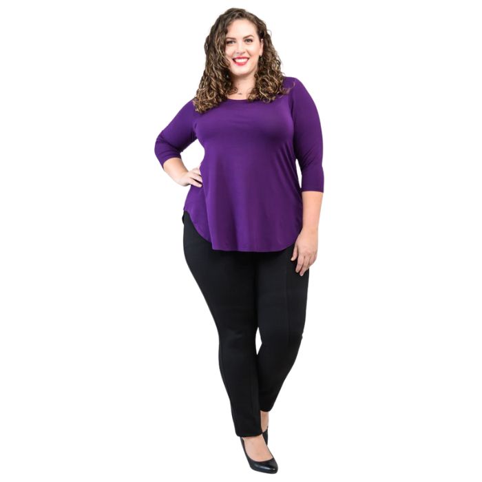 female model wearing jazz royal purple three quarter sleeve top and nadia black pants side view on white background