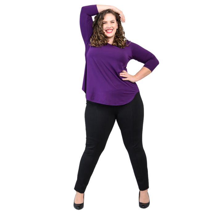 female model wearing jazz royal purple three quarter sleeve top and nadia black pants side view on white background