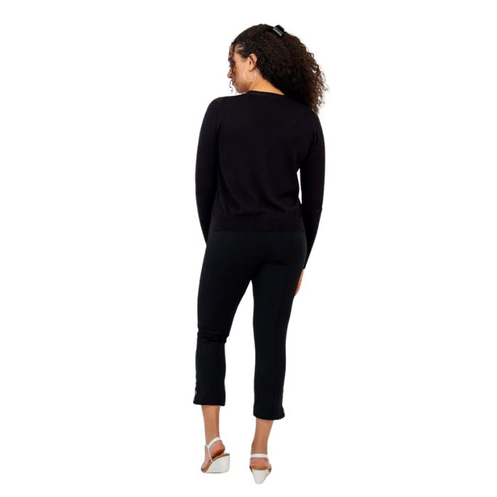 female model wearing jessica black button up cardigan sweater, reanna white tank top and nadine black cropped pants back view on white background
