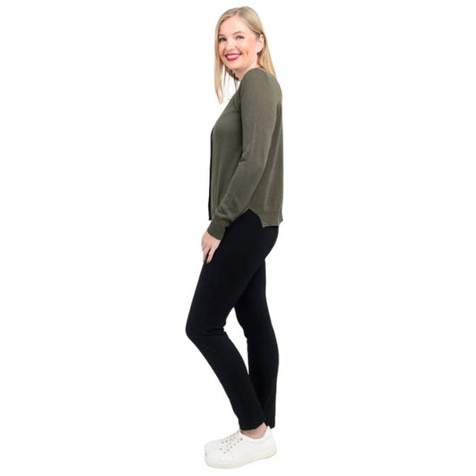 female model wearing jessica khaki green button up cardigan sweater, reanna white tank top and nadine black pants side view on white background