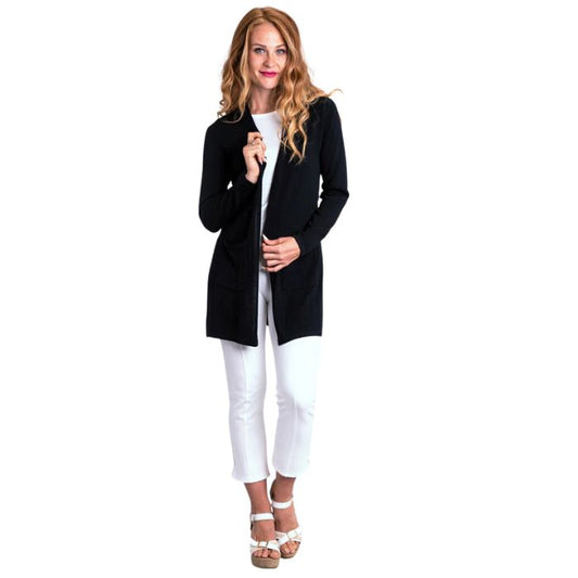 female model wearing justine black draped cardigan sweater and nadine white croppped pants front view on white background
