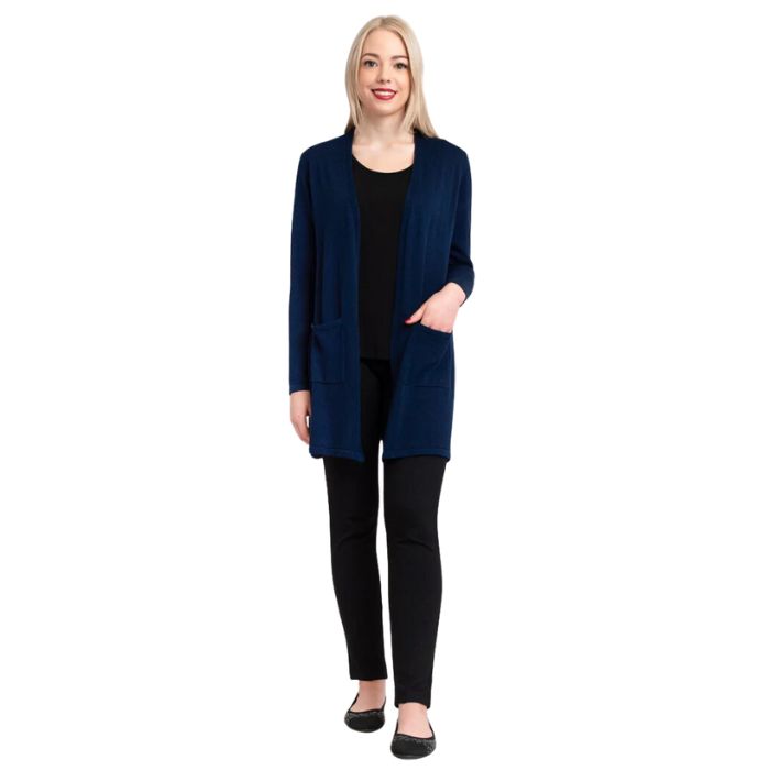 female model wearing justine indigo blue draped cardigan sweater, jazz black tank top and nadia black pants front view on white background