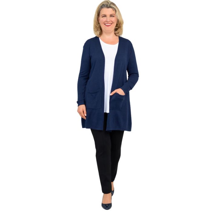 female model wearing justine indigo blue draped cardigan sweater, jazz white tank top and nadia black pants front view on white background
