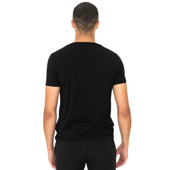 male model wearing black lawrence crew neck t-shirt back view on white background