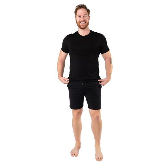 top of male model wearing black lawrence crew neck t-shirt and black aspen shorts front view on white background