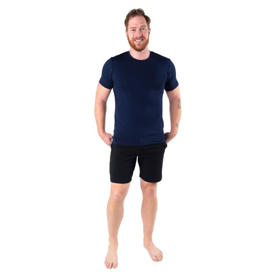 top of male model wearing ink blue lawrence crew neck t-shirt and black aspen shorts front view on white background