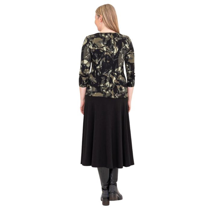 female model wearing margorie khaki oak three quarter sleeve top print and gillian black long skirt back view on white background