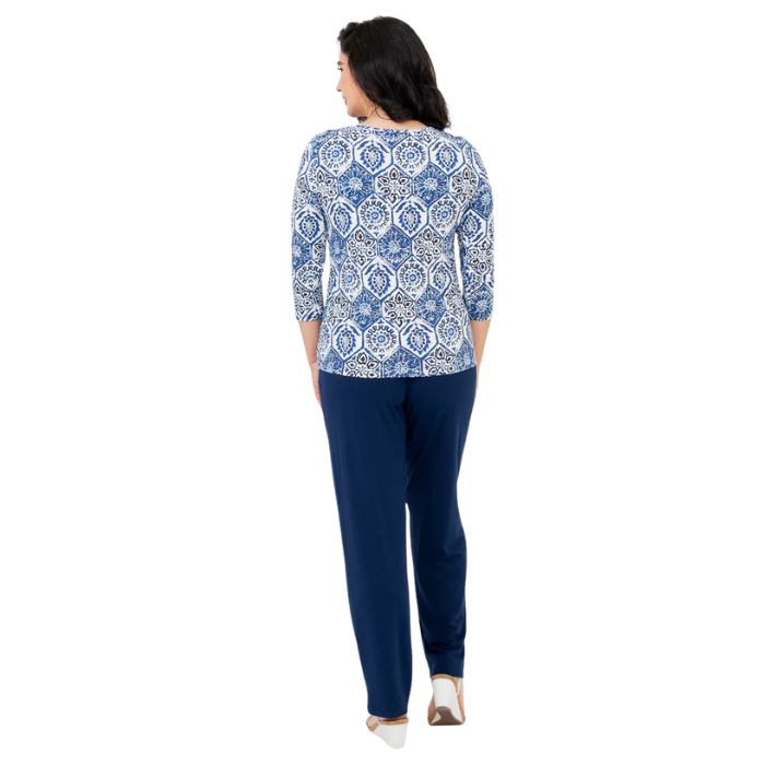 female model wearing margorie zesty print three quarter sleeve top and clair indigo blue pants back view on white background