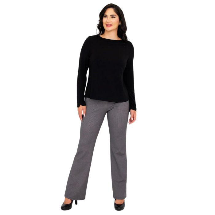 female model wearing mona black long sleeve top and daya pants front view on white background