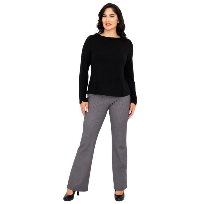 female model wearing mona black long sleeve top and daya pants front view on white background