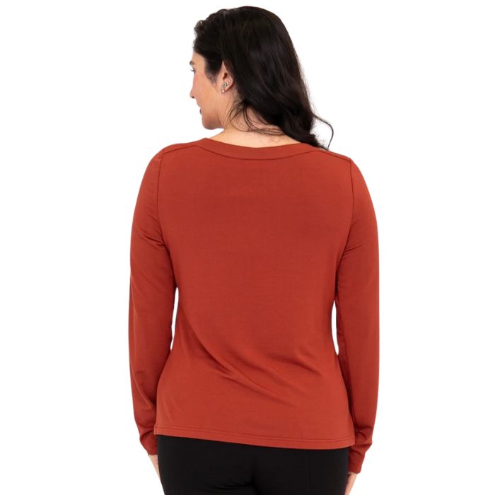 top of female model wearing mona cuprum orange long sleeve top back view on white background