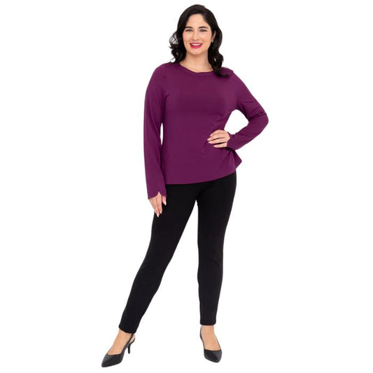 female model wearing mona magenta purple long sleeve top and nadia black pants front view on white background