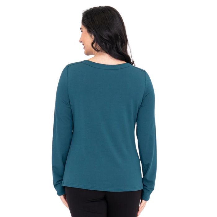top of female model wearing mona teal green long sleeve top back view on white background
