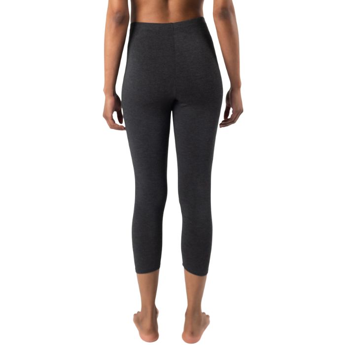 bottom of female model wearing charcoal grey suri capri length leggings back view on white background