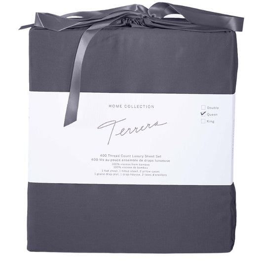 charcoal grey bamboo fabric bag containg sheet set- flat sheet, fitted sheet and two pillowcases on white background