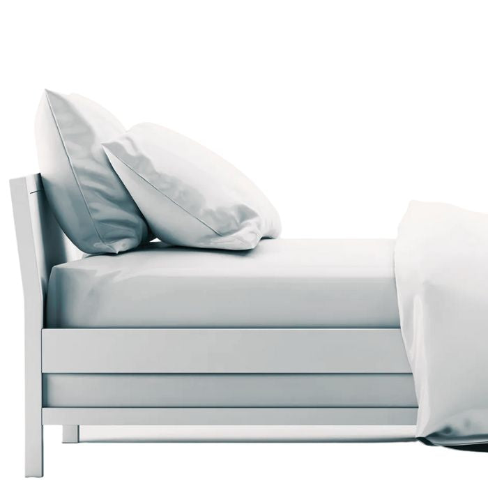 White sheet set- flat sheet, fitted sheet and two pillowcases on made bed