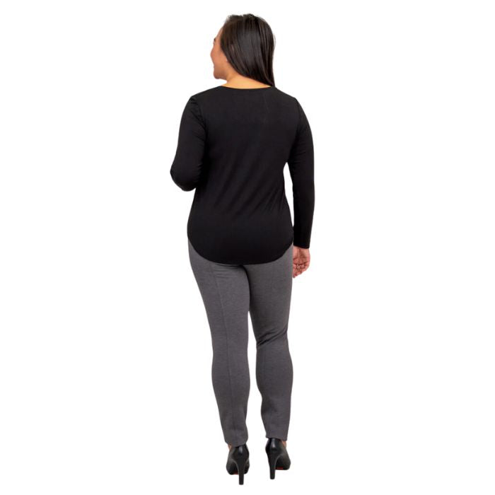 female model wearing tessa long sleeve top black and nadia granite grey pants back view on white background