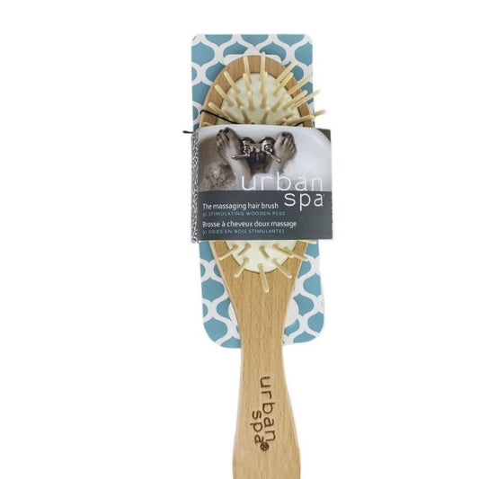 front view of the massaging hair brush in package