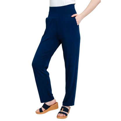 bottom of female model wearing indigo blue clair pants side view on white background