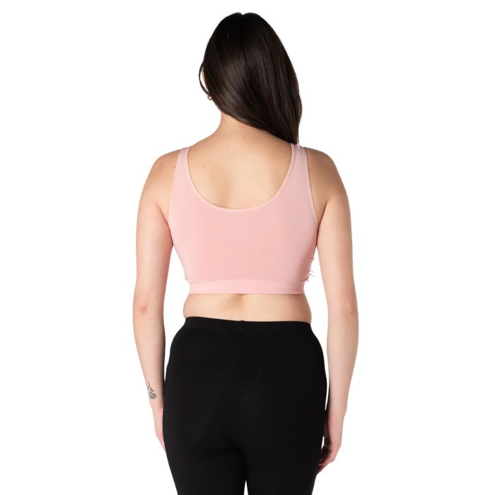 female model wearing pink terrera essential bralette back view on white background