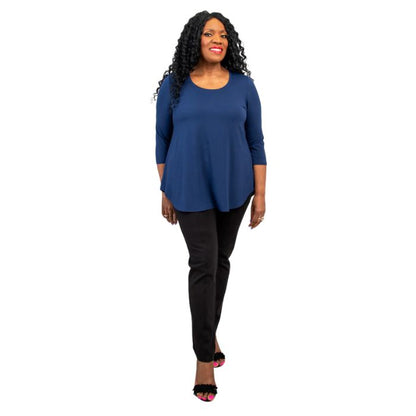 female model wearing jazz indigo blue three quarter sleeve top and nadia black pants front view on white background