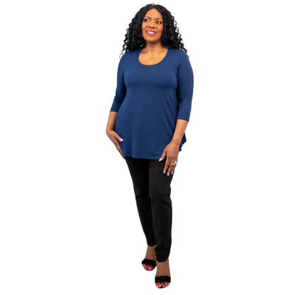 female model wearing jazz indigo blue three quarter sleeve top and nadia black pants front view on white background