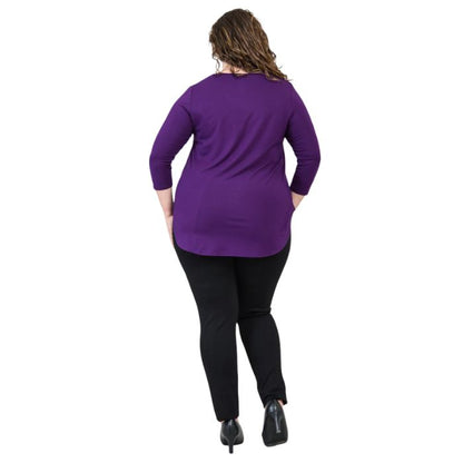 female model wearing jazz royal purple three quarter sleeve top and nadia black pants side view on white background