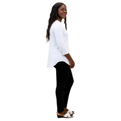 female model wearing jazz white three quarter sleeve top and nadia black pants side view on white background
