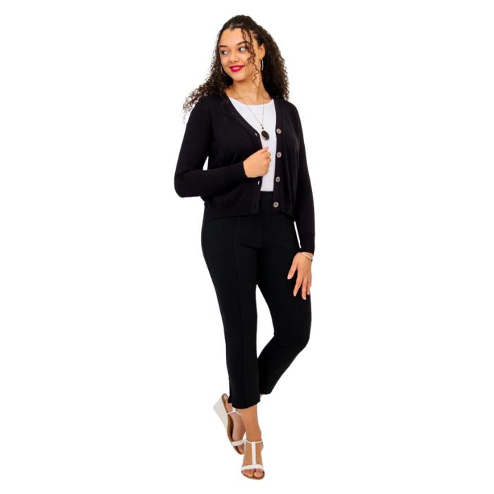 female model wearing black jessica button up cardigan sweater white reanna tank top and black nadine cropped pants front view on white background