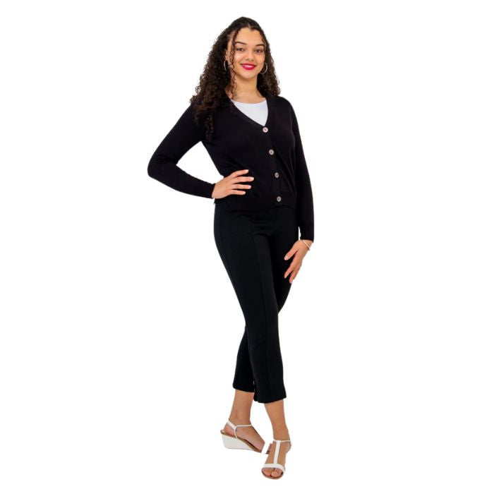 female model wearing black jessica button up cardigan sweater white reanna tank top and black nadine cropped pants front view on white background