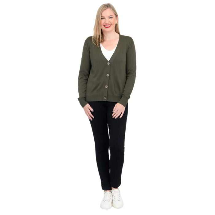 female model wearing jessica khaki green button up cardigan sweater, reanna white tank top and nadine black pants front view on white background