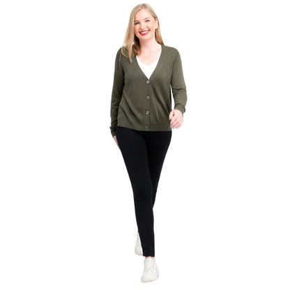 female model wearing jessica khaki green button up cardigan sweater, reanna white tank top and nadine black pants front view on white background
