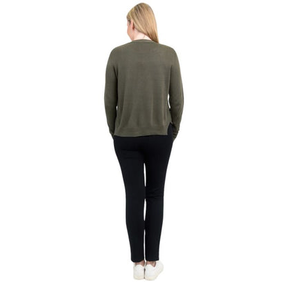 female model wearing khaki green jessica button up cardigan sweater, white reanna tank top and black nadia pants back view on white background