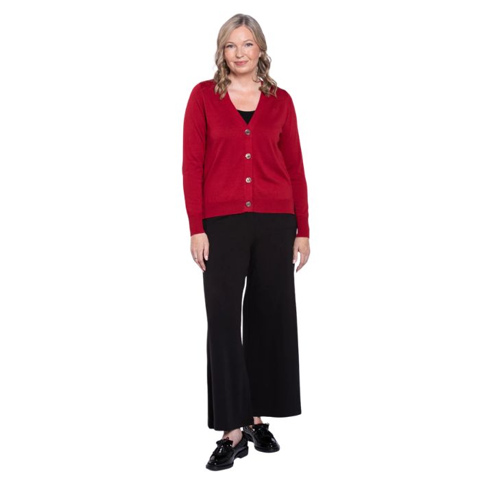 female model wearing lipstick red jessica button up cardigan sweater, black reanna tank top and black landon capri pants front view on white background