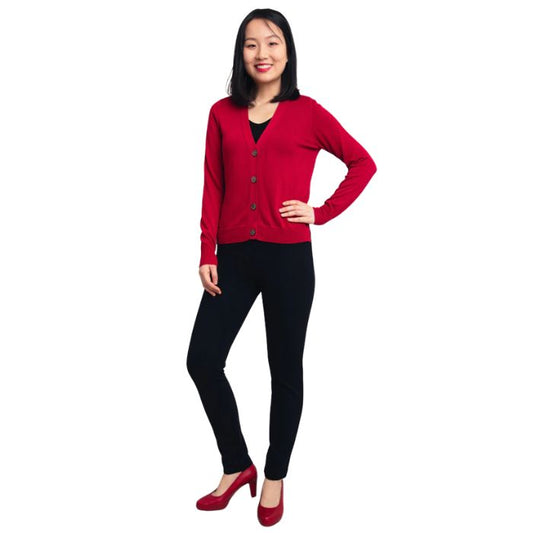 female model wearing lipstick red jessica button up cardigan sweater, black reanna tank top and black nadia pants front view on white background