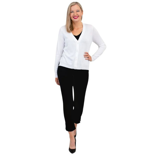 female model wearing jessica white button up cardigan sweater, reanna black tank top and nadine black cropped pants front view on white background