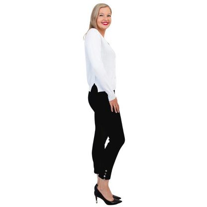 female model wearing jessica white button up cardigan sweater, reanna black tank top and nadine black cropped pants side view on white background