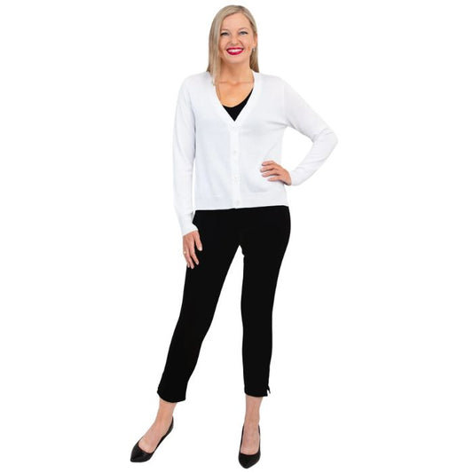 female model wearing white jessica button up cardigan sweater, black reanna tank top and black nadine cropped pants front view on white background