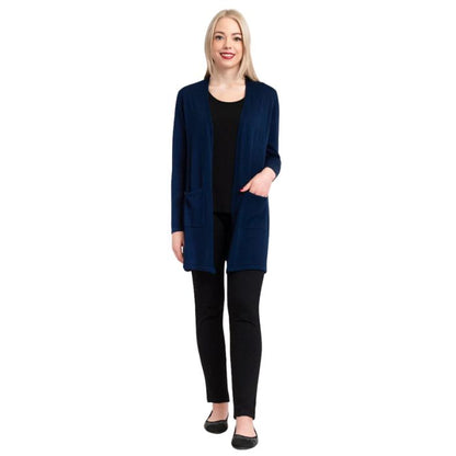 female model wearing justine indigo blue draped cardigan sweater, jazz black tank top and nadia black pants front view on white background