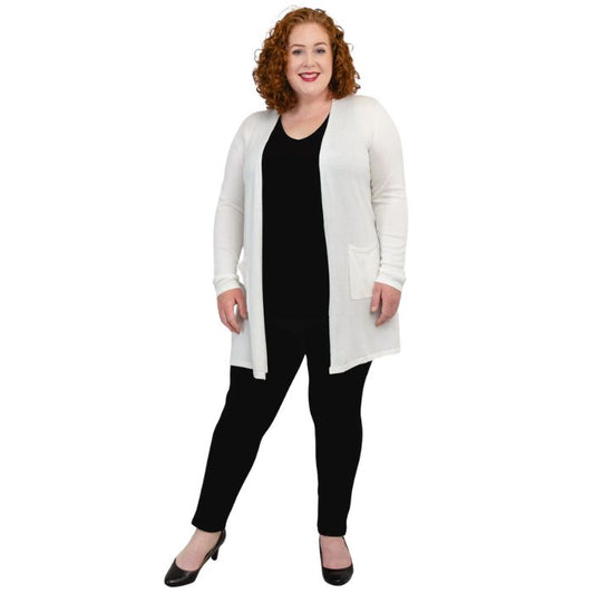 female model wearing white justine draped cardigan sweater over black reanna tank top and black nadia pants  front view on white background