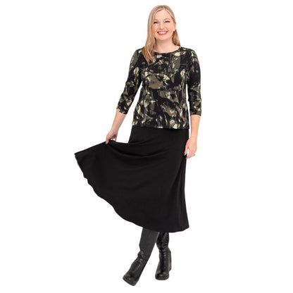 female model wearing margorie khaki oak three quarter sleeve top print and gillian black long skirt front view on white background