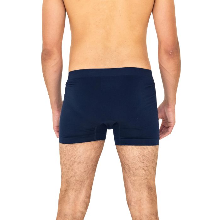 man wearing ink blue terrera boxer briefs mid seaction back view set on a white background